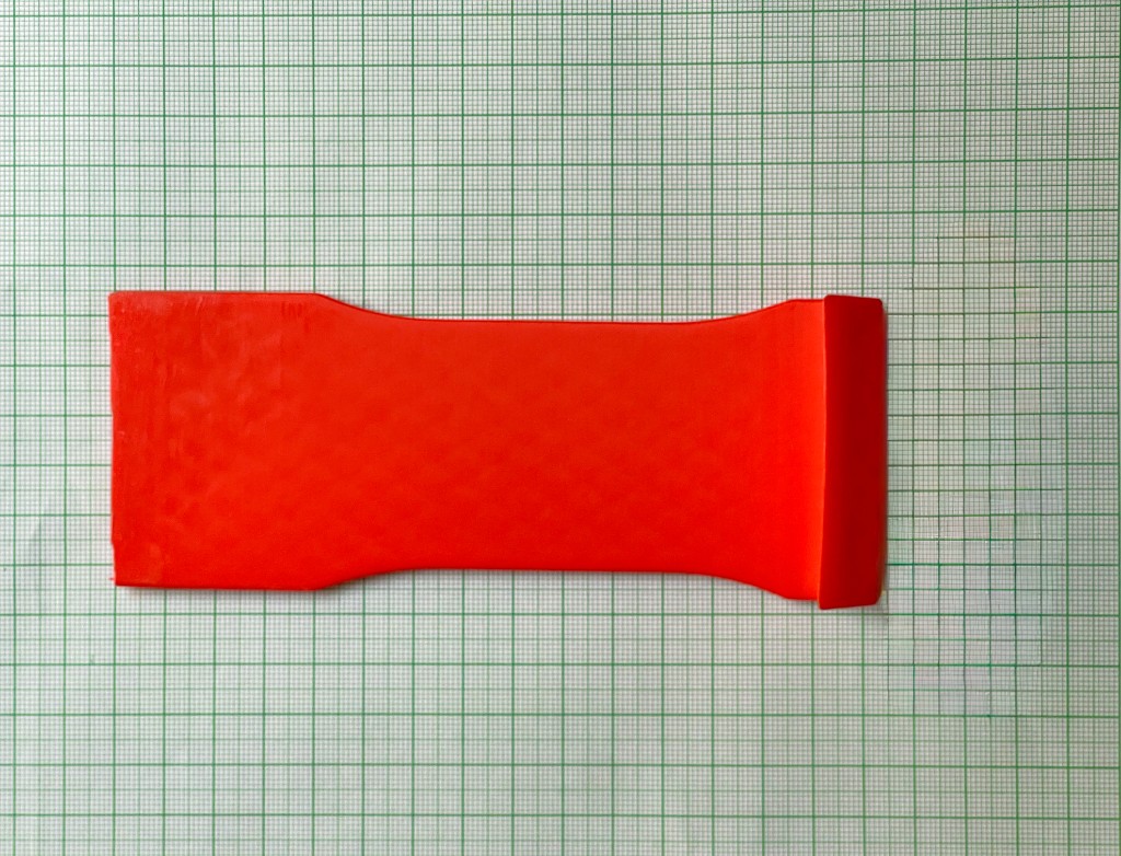 3D printed production part measured on engineering grid paper for reverse engineering